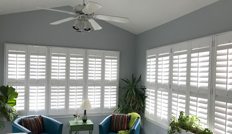 Boston living room with fan and shutters